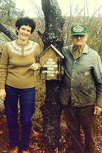 CATHOLINE and Martin Brown on the mountain top overlooking Rogers Lake on the Brown family farm.